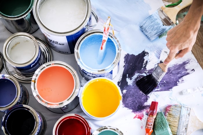 left over paint cans and brush